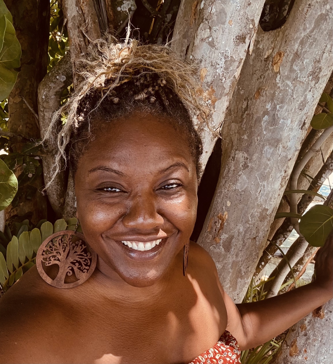 Rikkia smiling among mature waterfront trees during independent discovery time